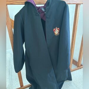 Harry Potter Gryffindor Robe. It is in new condition with working buttons